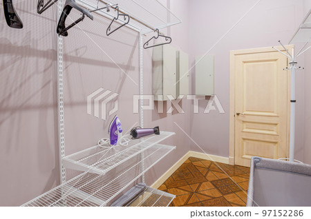 A small room in the house for storing wardrobe and household items A small room in the house for storing wardrobe and household items 97152286