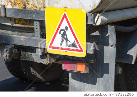 Road warning signs on repair vehicles, close-up 97152290