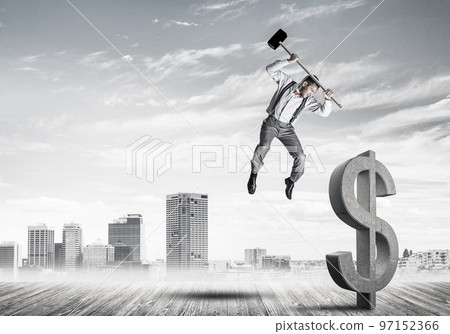 Determined banker man against modern cityscape breaking dollar concrete figure Determined banker man against modern cityscape breaking dollar concrete figure 97152366