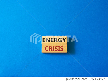 Energy crisis symbol. Concept word Energy crisis on wooden blocks. Beautiful blue background. Business and Energy crisis concept. Copy space Energy crisis symbol. Concept word Energy crisis on wooden blocks. Beautiful blue background. Business and Energy crisis concept. Copy space 97153474