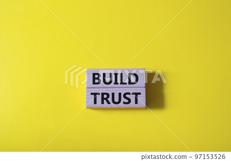 Build trust symbol. Wooden blocks with words Build trust. Beautiful yellow background. Business and Build trust concept. Copy space. Build trust symbol. Wooden blocks with words Build trust. Beautiful yellow background. Business and Build trust concept. Copy space. 97153526