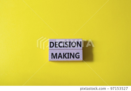 Decision making symbol. Wooden blocks with words Decision making. Beautiful yellow background. Business and Decision making concept. Copy space. Decision making symbol. Wooden blocks with words Decision making. Beautiful yellow background. Business and Decision making concept. Copy space. 97153527