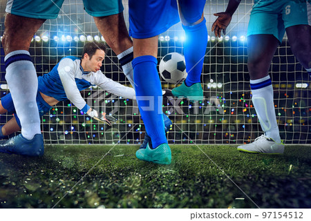 Football scene with soccer players and goalkeeper at the stadium Football scene with soccer players and goalkeeper at the stadium 97154512