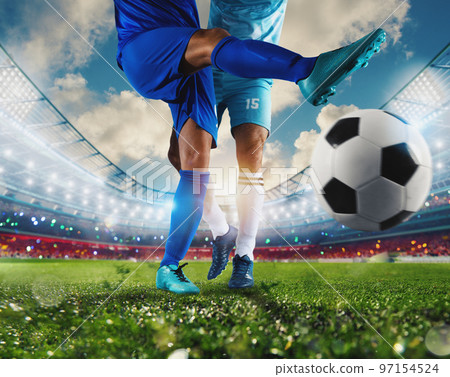 Football scene with competing soccer players at the stadium 97154524