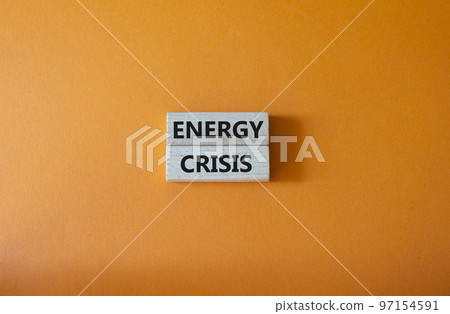 Energy crisis symbol. Concept word Energy crisis on wooden blocks. Beautiful orange background. Business and Energy crisis concept. Copy space 97154591