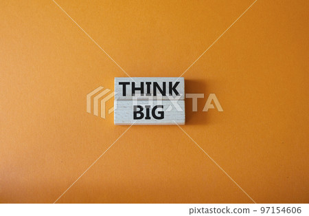 Think big symbol. Wooden blocks with words Think big. Beautiful orange background. Business and Think big concept. Copy space. Think big symbol. Wooden blocks with words Think big. Beautiful orange background. Business and Think big concept. Copy space. 97154606