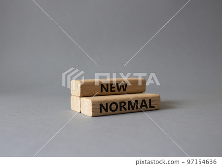 New normal symbol. Concept word New normal on wooden blocks. Beautiful grey background. Business and New normal concept. Copy space 97154636