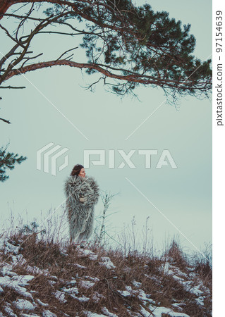 Woman in Historical Ukrainian winter clothing - gunia, sheepskin coat Woman in Historical Ukrainian winter clothing - gunia, sheepskin coat 97154639