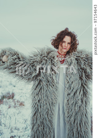 Woman in Historical Ukrainian winter clothing - gunia, sheepskin coat Woman in Historical Ukrainian winter clothing - gunia, sheepskin coat 97154643