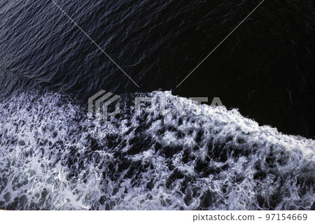 Rough waves seen from the deck of the ship in the evening Rough waves seen from the deck of the ship in the evening 97154669