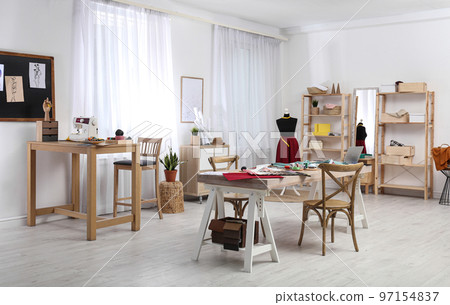 Fashion designer's workplace in studio. Creating new clothes 97154837