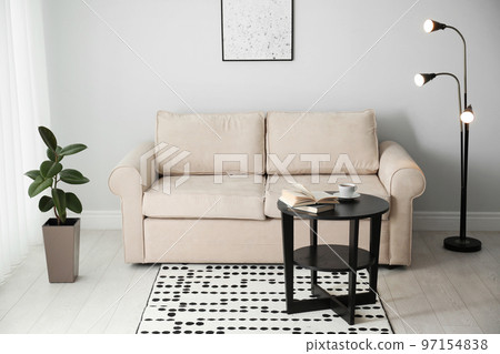 Modern comfortable sofa in stylish home interior 97154838