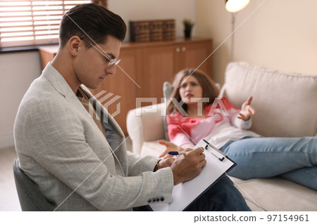 Professional psychotherapist working with patient in office 97154961