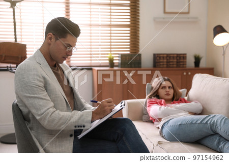 Professional psychotherapist working with patient in office 97154962