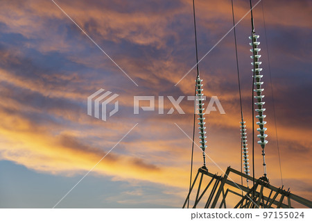 Electricity pylon (high voltage power line) against the background of a romantic evening sky Electricity pylon (high voltage power line) against the background of a romantic evening sky 97155024