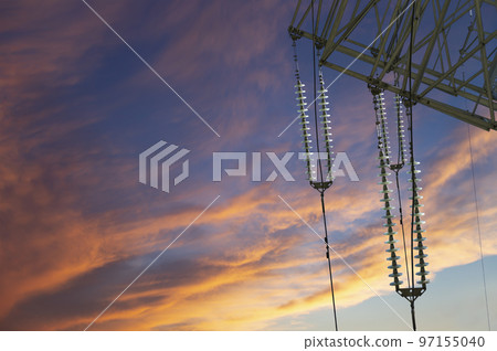 Electricity pylon (high voltage power line) against the background of a romantic evening sky 97155040