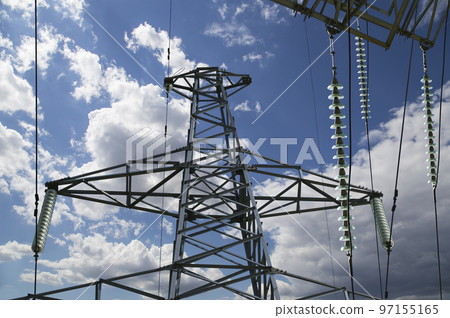 Electricity pylon (high voltage power line) on the background of the cloudy sky 97155165