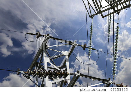 Electricity pylon (high voltage power line) on the background of the cloudy sky 97155525