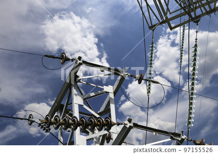Electricity pylon (high voltage power line) on the background of the cloudy sky 97155526