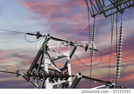 Electricity pylon (high voltage power line) against the background of a romantic evening sky 97155535