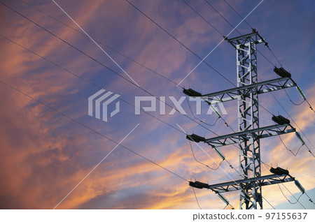 Electricity pylon (high voltage power line) against the background of a romantic evening sky Electricity pylon (high voltage power line) against the background of a romantic evening sky 97155637