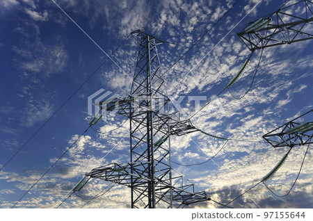Electricity pylon (high voltage power line) on the background of the cloudy sky Electricity pylon (high voltage power line) on the background of the cloudy sky 97155644