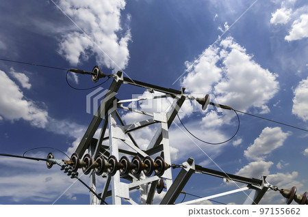 Electricity pylon (high voltage power line) on the background of the cloudy sky Electricity pylon (high voltage power line) on the background of the cloudy sky 97155662