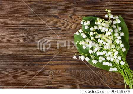 Bouquet of lilies of the valley on the wooden background 97156529
