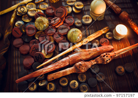 Magic still life with runes and magic wands 97157197
