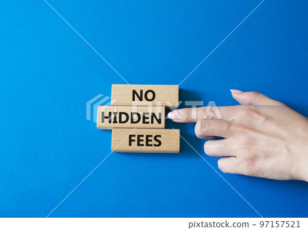No hidden fees symbol. Concept word No hidden fees on wooden blocks. Businessman hand. Beautiful blue background. Business and No hidden fees concept. Copy space 97157521