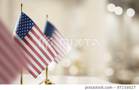 Small flags of the USA on an abstract blurry background Small flags of the USA on an abstract blurry background 97158027