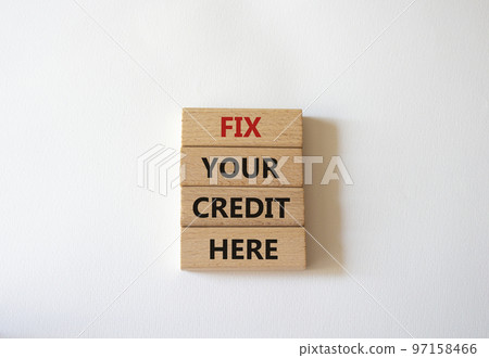 Fix your credit here symbol. Concept words Fix your credit here on wooden blocks. Beautiful white background. Business and Fix your credit here concept. Copy space. 97158466