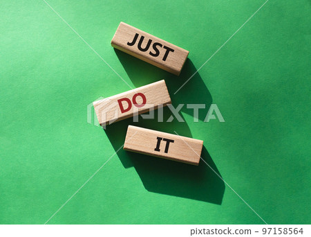 Just do it symbol. Wooden blocks with words Just do it. Beautiful green background. Business and Just do it concept. Copy space. Just do it symbol. Wooden blocks with words Just do it. Beautiful green background. Business and Just do it concept. Copy space. 97158564