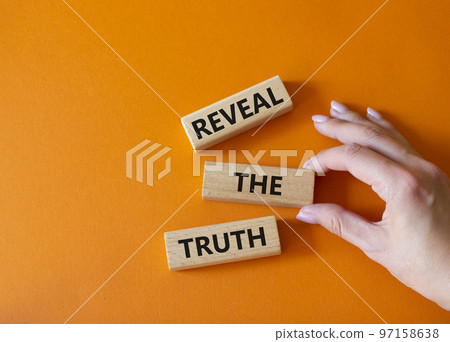 Reveal the truth symbol. Concept word Reveal the truth on wooden blocks. Businessman hand. Beautiful orange background. Business and Reveal the truth concept. Copy space Reveal the truth symbol. Concept word Reveal the truth on wooden blocks. Businessman hand. Beautiful orange background. Business and Reveal the truth concept. Copy space 97158638