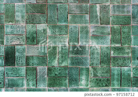 Green ceramic tile background. Old vintage ceramic tiles in green to decorate the kitchen or bathroom  97158712