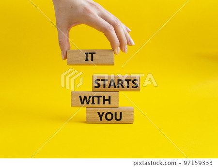 It starts with you symbol. Wooden blocks with words It starts with you. Beautiful yellow background. Businessman hand. Business and It starts with you concept. Copy space. It starts with you symbol. Wooden blocks with words It starts with you. Beautiful yellow background. Businessman hand. Business and It starts with you concept. Copy space. 97159333