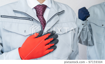 two people in work clothes two people in work clothes 97159384
