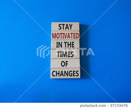 Motivation and changes symbol. Concept words Stay motivated in the times of changes on wooden blocks. Beautiful blue background. Business concept. Copy space. Motivation and changes symbol. Concept words Stay motivated in the times of changes on wooden blocks. Beautiful blue background. Business concept. Copy space. 97159476