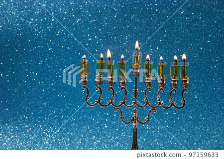 Jewish holiday Hanukkah background with menorah -traditional candelabra and candles Jewish holiday Hanukkah background with menorah -traditional candelabra and candles 97159633