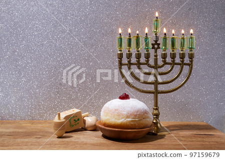 Jewish holiday Hanukkah background with menorah and dreidel with letters Gimel and Nun. Jewish holiday Hanukkah background with menorah and dreidel with letters Gimel and Nun. 97159679
