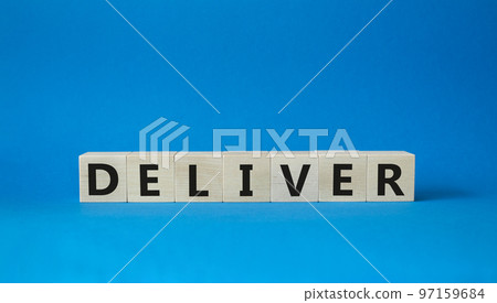 Deliver symbol. Concept word Deliver on wooden cubes. Beautiful blue background. Business and Deliver concept. Copy space. 97159684