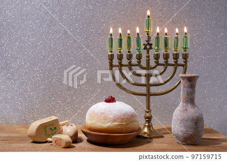 Jewish holiday Hanukkah background with menorah and dreidel with letters Gimel and Nun. 97159715