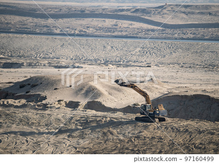 Excavator Machine at Excavation Earthmoving in Sand Desert Quarry. Construction Industry concept. 97160499