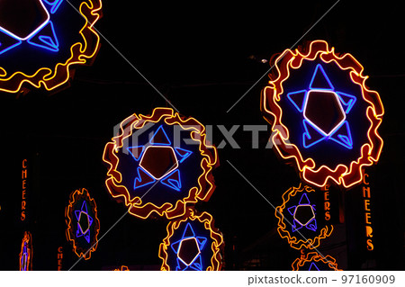 Neon lights shaped into traditional parol, a Filipino ornamental lantern displayed during the Christmas season Neon lights shaped into traditional parol, a Filipino ornamental lantern displayed during the Christmas season 97160909