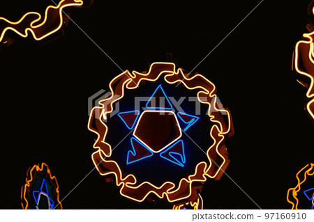 Neon lights shaped into traditional parol, a Filipino ornamental lantern displayed during the Christmas season Neon lights shaped into traditional parol, a Filipino ornamental lantern displayed during the Christmas season 97160910