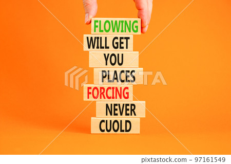 Flowing symbol. Concept words Flowing will get you places forcing never could on wooden blocks. Beautiful orange background copy space. Businessman hand. Business motivational flowing concept. Flowing symbol. Concept words Flowing will get you places forcing never could on wooden blocks. Beautiful orange background copy space. Businessman hand. Business motivational flowing concept. 97161549