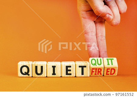 Quiet quit or fired symbol. Concept words Quiet quit and Quiet fired on wooden cubes. Businessman hand. Beautiful orange table orange background. Business quiet quit or fired concept. Copy space. Quiet quit or fired symbol. Concept words Quiet quit and Quiet fired on wooden cubes. Businessman hand. Beautiful orange table orange background. Business quiet quit or fired concept. Copy space. 97161552