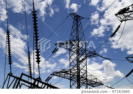 Electricity pylon (high voltage power line), black contour,  on the background of the cloudy sky 97161660