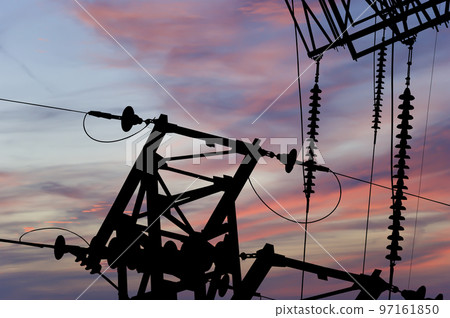 Electricity pylon (high voltage power line), black contour, against the background of a romantic evening sky Electricity pylon (high voltage power line), black contour, against the background of a romantic evening sky 97161850