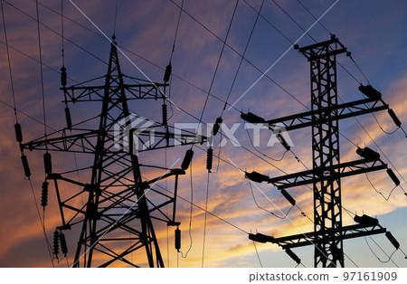 Electricity pylon (high voltage power line), black contour, against the background of a romantic evening sky Electricity pylon (high voltage power line), black contour, against the background of a romantic evening sky 97161909